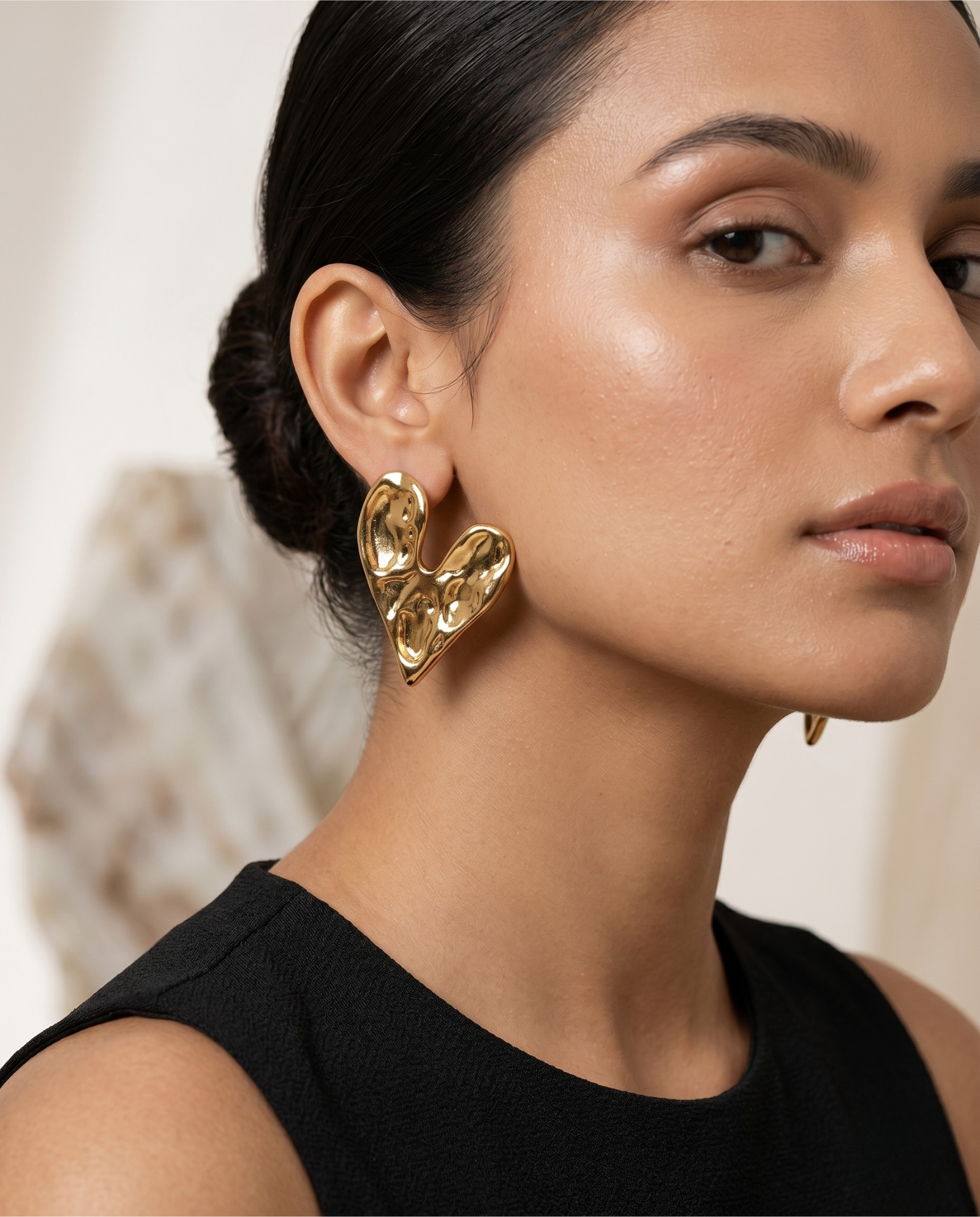 abstract gold sculpted heart stud earrings for women | modern minimal gold earrings