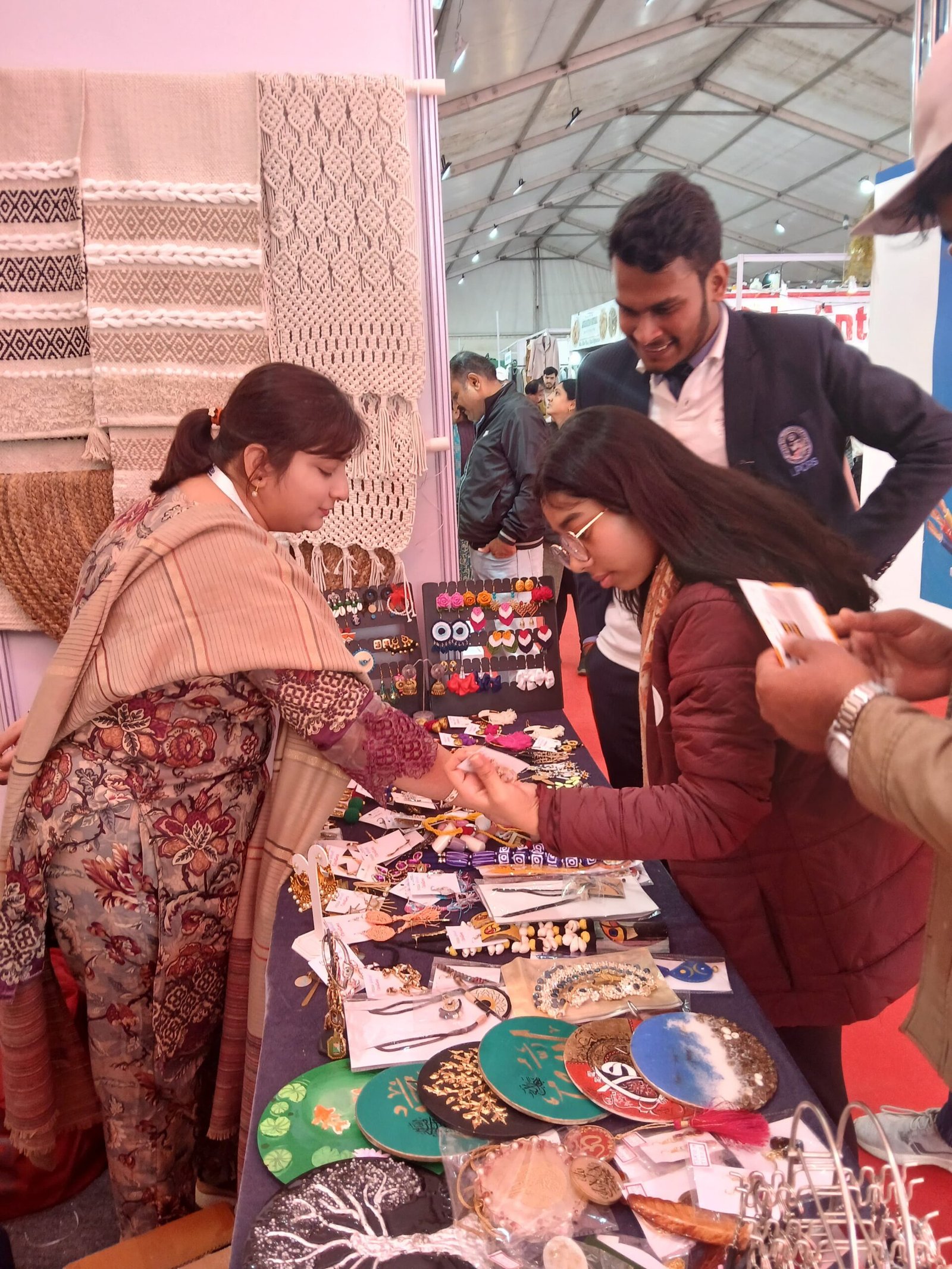 Customers browsing the Ferris Wheel Creations stall, UPITEX 2025